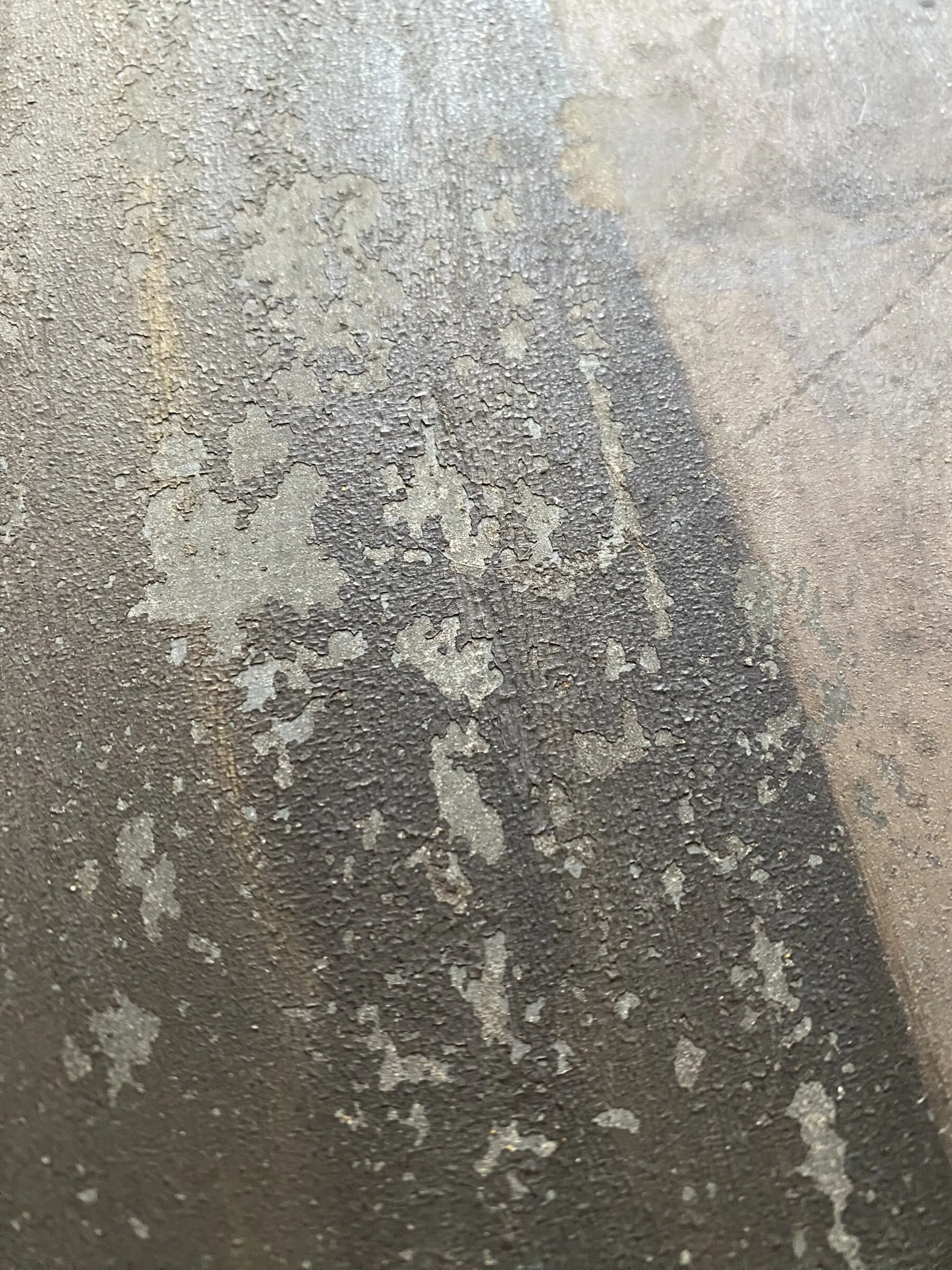 Before restoration. Detail of the surface with dirt and damage.