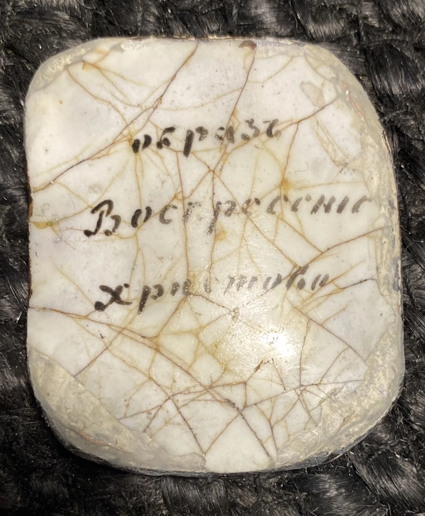 Reverse of the icon “The Resurrection of Christ”. Inscription and cracks in the enamel.
